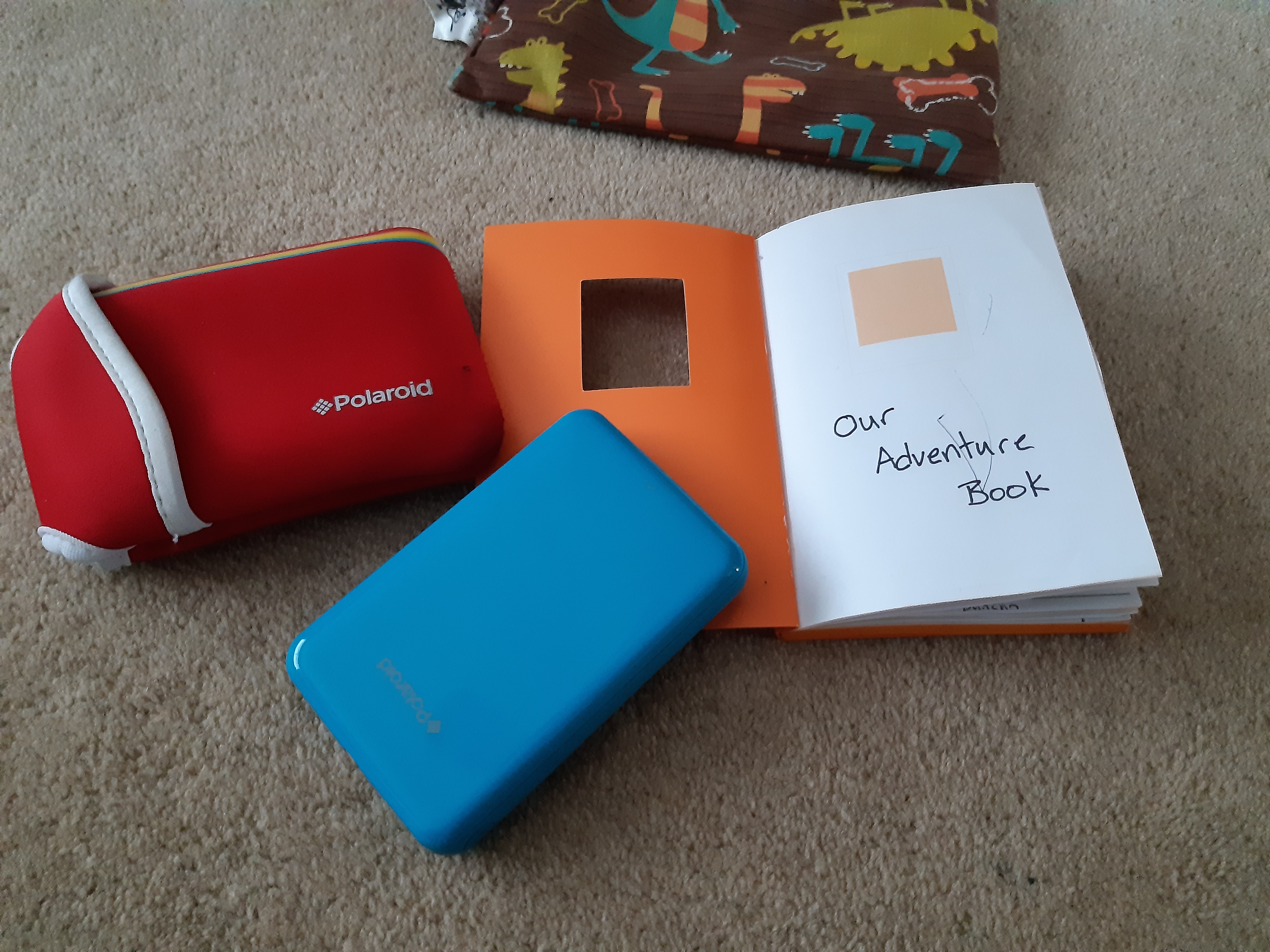 Our Adventure Book Blue Polaroid Printer with notebook