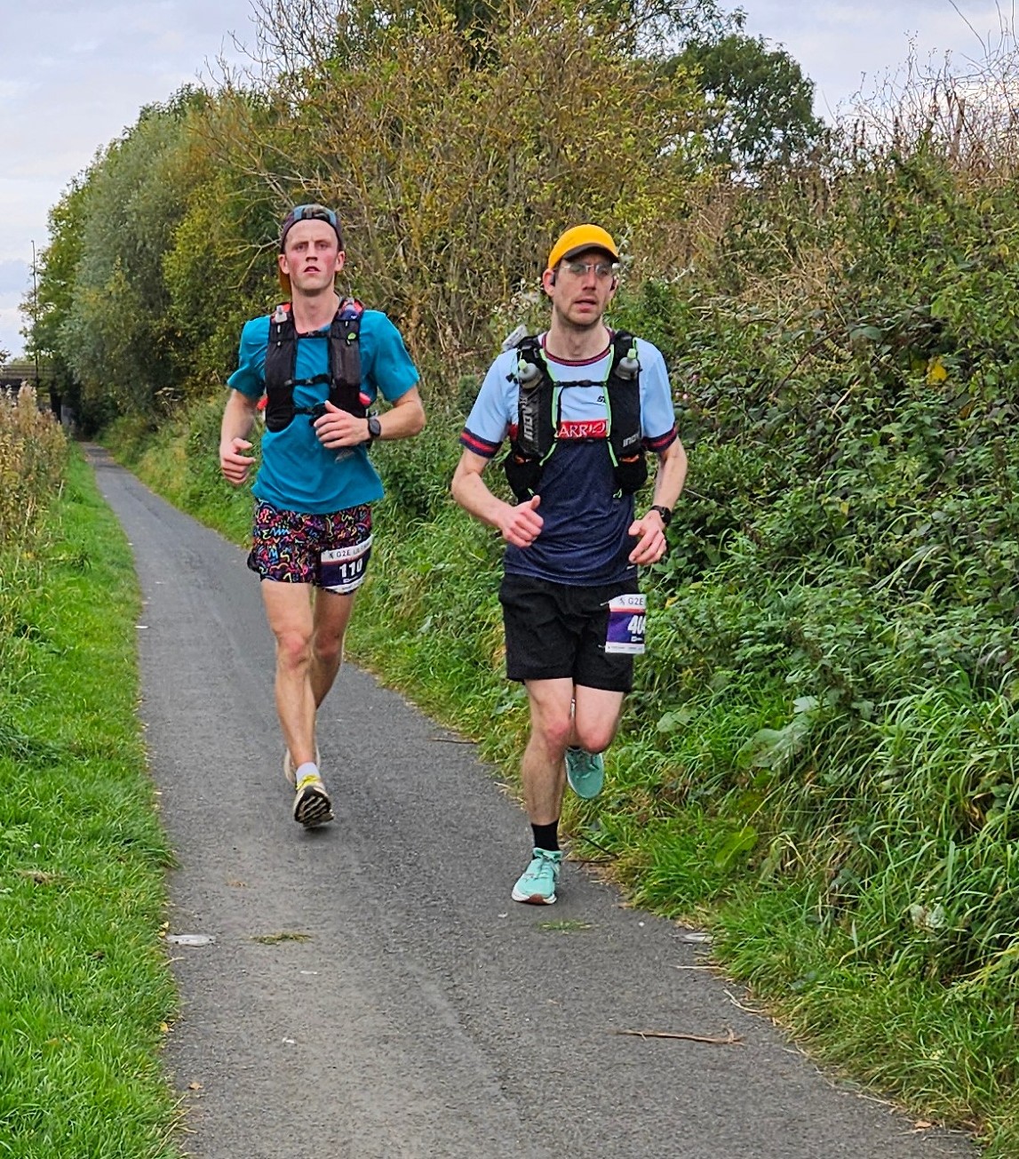 Working together Me running along the canal path with another man running close behind. Credit: Derek Marshall